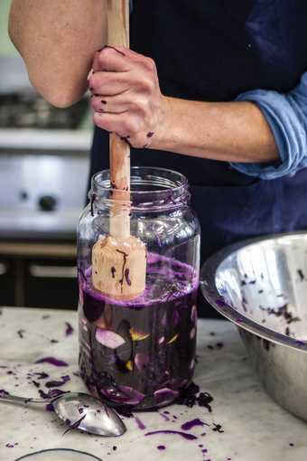 Lauren Mauer preparing homemade cordial at Studio Olafur Eliasson.