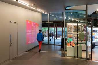 a person walks through some automatic doors 