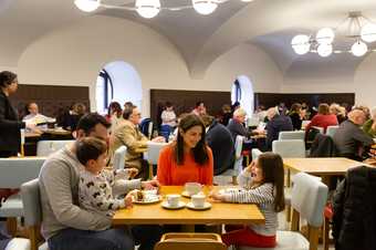 a family sit and eat at the cafe in Tate Britain